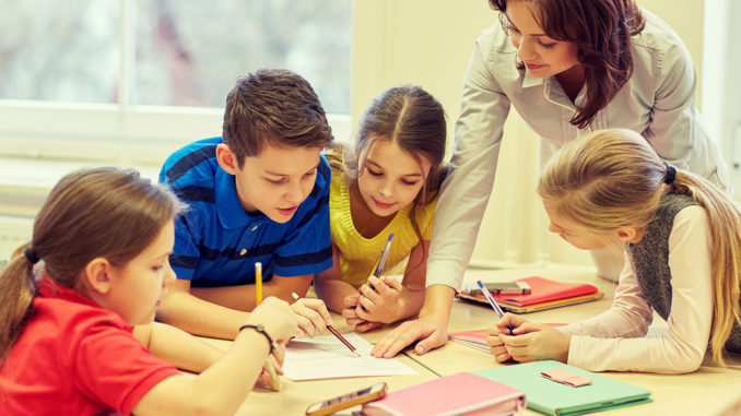 education, elementary school, learning and people concept - teac